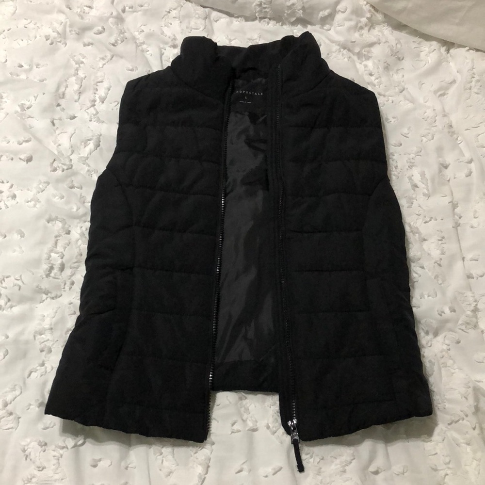Black sleeveless jacket